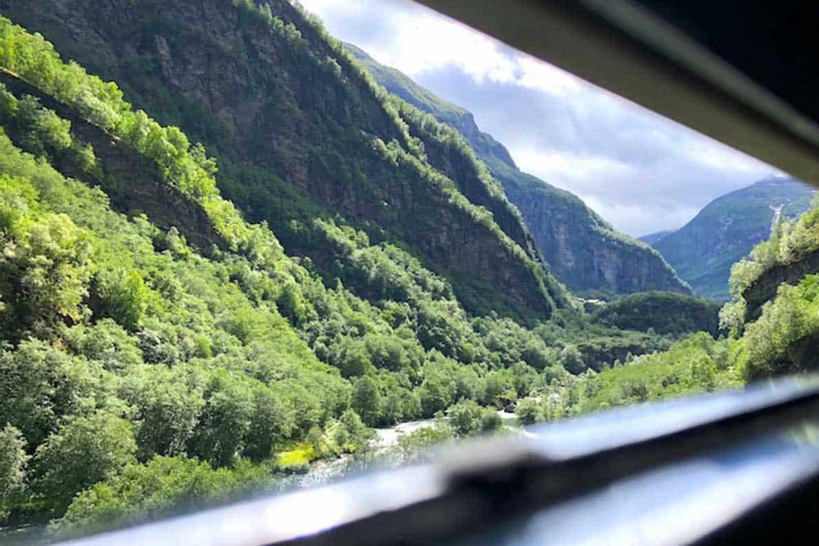 Is the Flamsbana railway in Norway REALLY the most beautiful railway ride in the world? Should you go out of your way to visit Flam during your Norway travel? Here's everything you need to know about riding Flamsbana railway in Norway #norway #flam #flamsbana #railway #beautifulplaces #thingstodo #traveltips #trainjourney