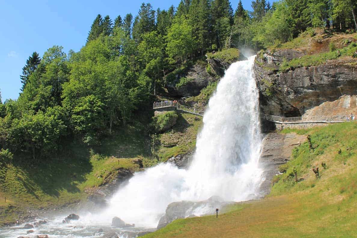 Steinsdalsfossen Waterfall in Norway is AMAZING- you can actually walk BEHIND the waterfall. It's one of the best things we did on our road trip to Norway. Definitely add it to your itinerary! #norway #steinsdalsfossen #roadtrip #waterfall #thingstodo #traveltips #roadtriptips #beautifulplaces