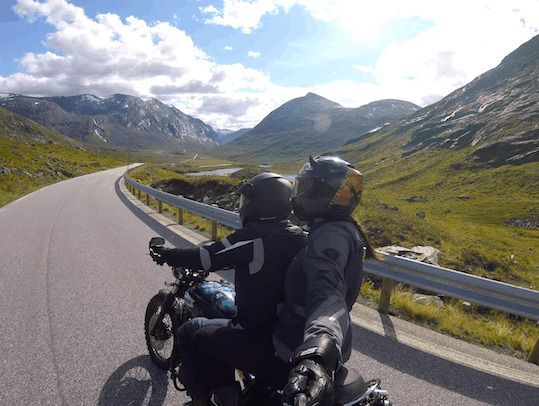 Ever heard of Norway's crazy road? 11 hairpins bends going up the steep side of a mountain!?!?! We rode Trollstigen road on a motorbike- and it was EPIC! Add Trollstigen road to your Norway itinerary immediately! #trollstigen #norway #roadtrip #tips #crazyroad #trollsladder #motorbike #vanlife